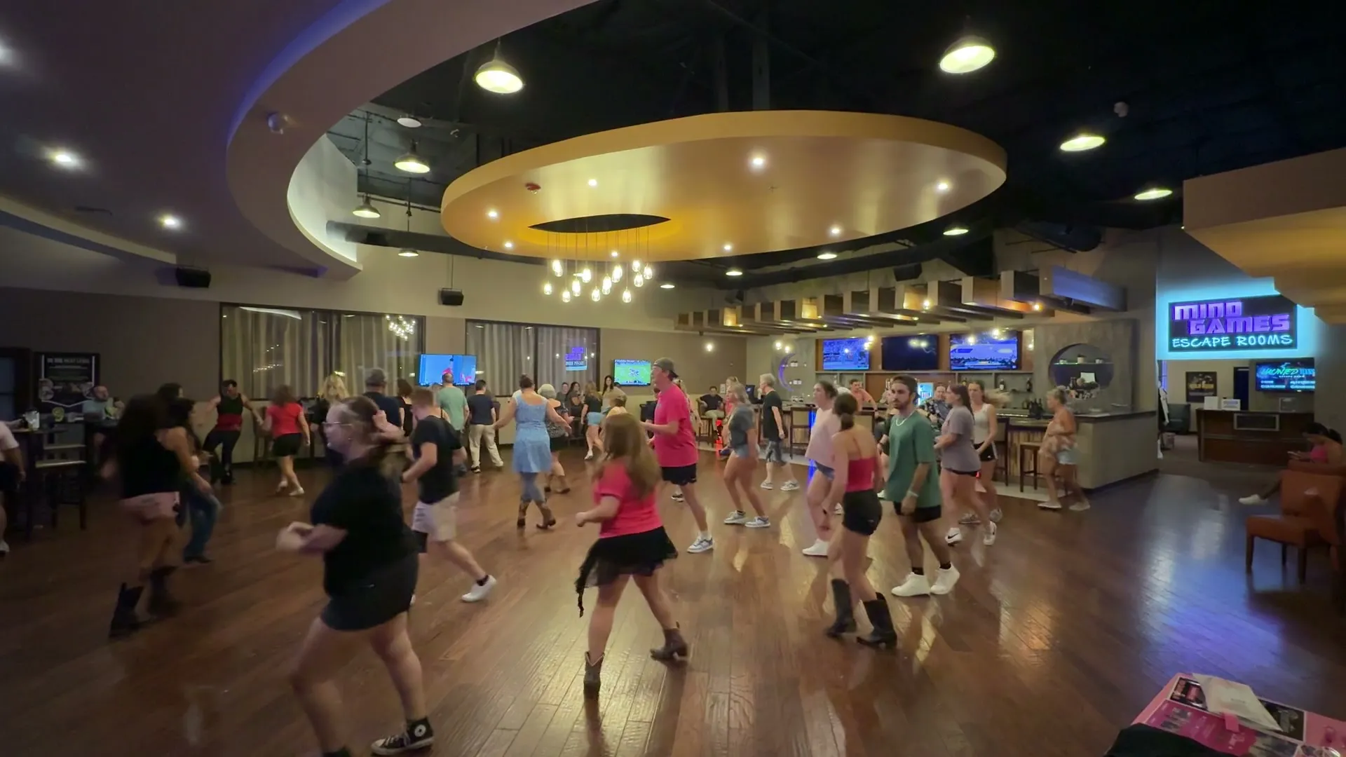 Dancers learning together during a real recurring Rhinestone dance night at Spare Time Greenville.